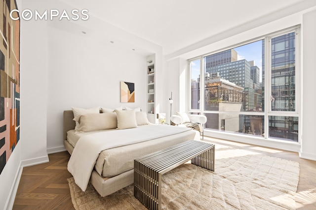 330 Spring St Unit 7D, New York City, NY 10013 - bedroom with baseboards and a view of city