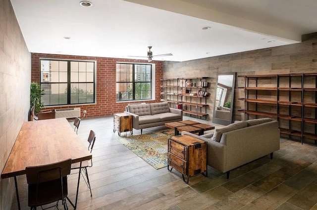 42-60 Crescent St Unit 7D, New York City, NY 11101 - living room featuring ceiling fan, a wall unit AC, and hardwood / wood-style floors