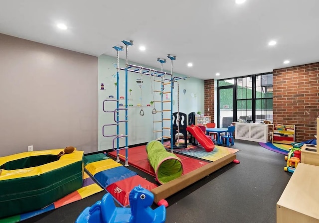 42-60 Crescent St Unit 7D, New York City, NY 11101 - rec room featuring recessed lighting and brick wall