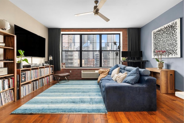 42-60 Crescent St Unit 7D, New York City, NY 11101 - living room with ceiling fan, wood finished floors, and a wall mounted air conditioner