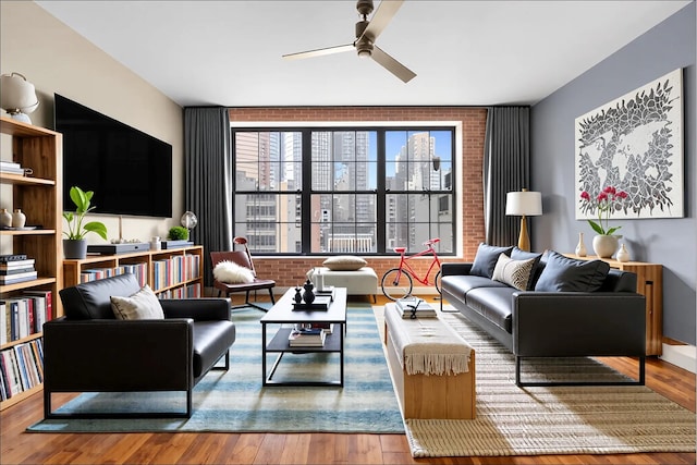 42-60 Crescent St Unit 7D, New York City, NY 11101 - living area with a view of city, ceiling fan, and hardwood / wood-style flooring