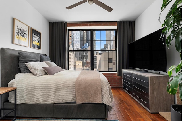 42-60 Crescent St Unit 7D, New York City, NY 11101 - bedroom with ceiling fan and dark wood-style floors