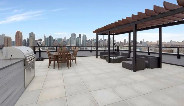 view of patio / terrace with a city view, an outdoor hangout area, a pergola, a grill, and exterior kitchen