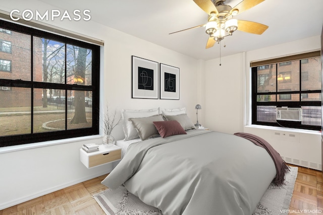 355 Clinton Ave Unit 1F, New York City, NY 11238 - bedroom with baseboards and a ceiling fan