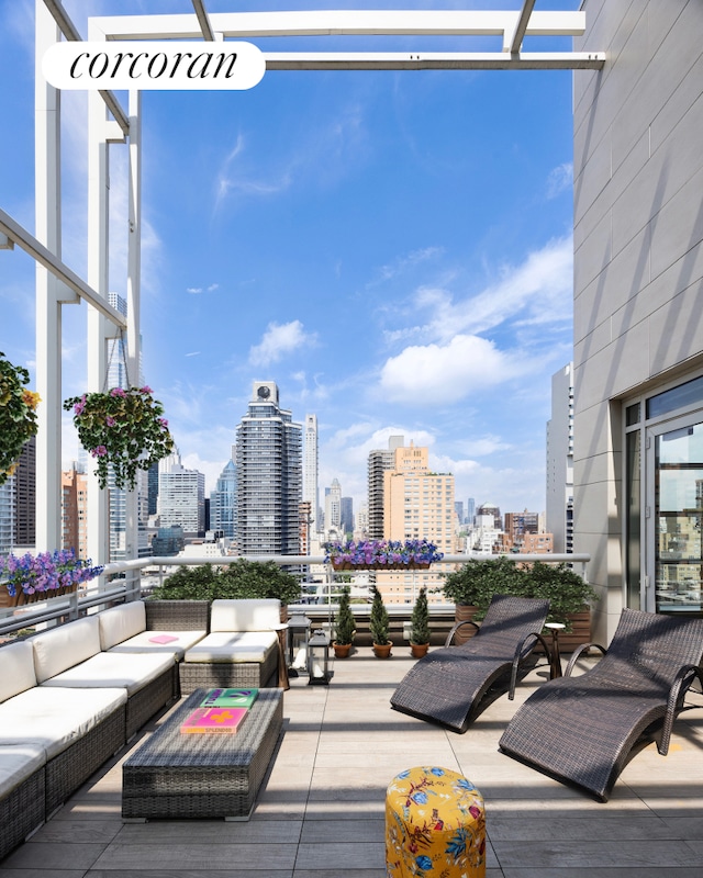 301 E 61st Street Penthouse, New York City, NY 10065 - view of patio with an outdoor hangout area and a skyline view