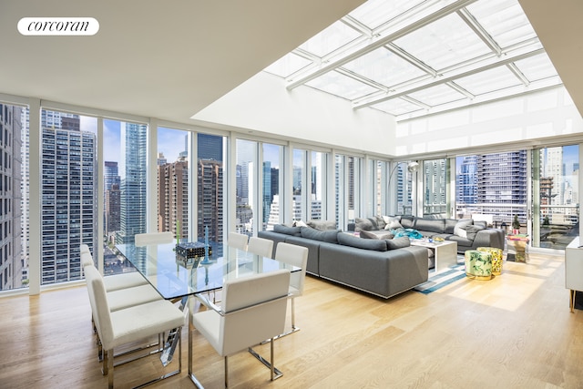 301 E 61st Street Penthouse, New York City, NY 10065 - sunroom with wood finished floors and a skyline view