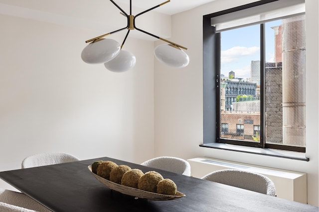 dining space featuring a view of city