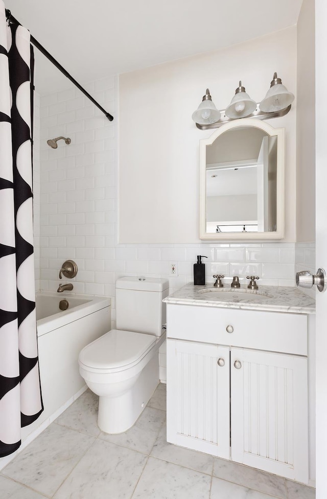 full bathroom with tile walls, toilet, shower / tub combo, and vanity