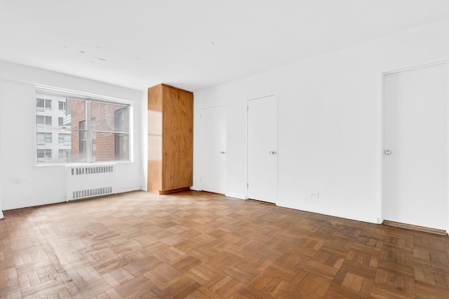 50 Sutton Pl S Unit 8H, New York City, NY 10022 - empty room with radiator heating unit