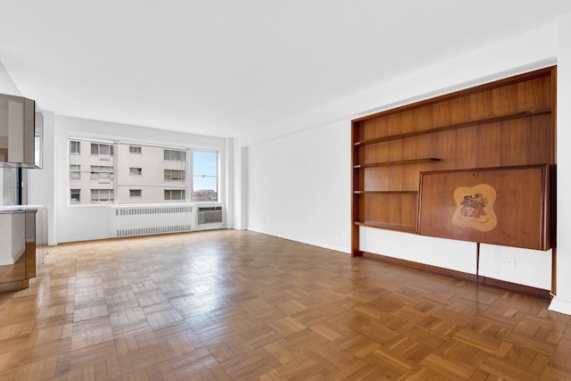 50 Sutton Pl S Unit 8H, New York City, NY 10022 - unfurnished living room with radiator and baseboards