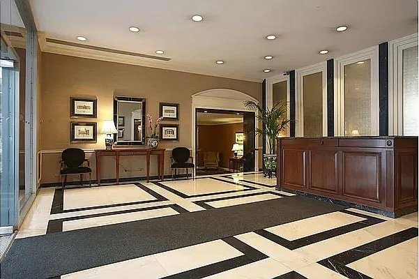 50 Sutton Pl S Unit 8H, New York City, NY 10022 - building lobby with recessed lighting and crown molding