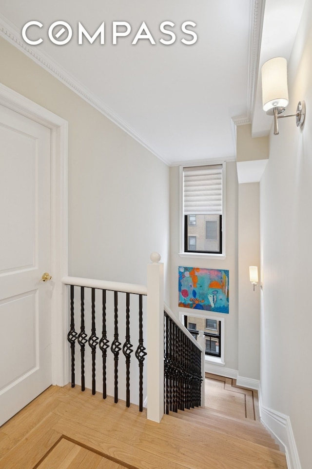 514 W End Ave Unit 8/9A, New York City, NY 10024 - stairway featuring crown molding and wood finished floors