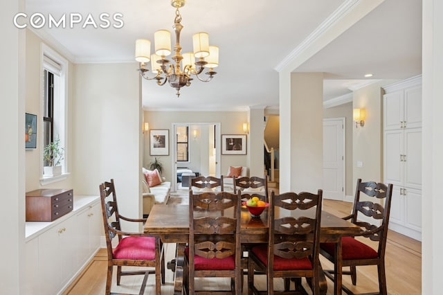 514 W End Ave Unit 8/9A, New York City, NY 10024 - dining space featuring light wood-type flooring, ornamental molding, and a chandelier