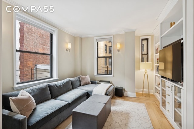 514 W End Ave Unit 8/9A, New York City, NY 10024 - living room with plenty of natural light, ornamental molding, baseboards, and light wood-style flooring