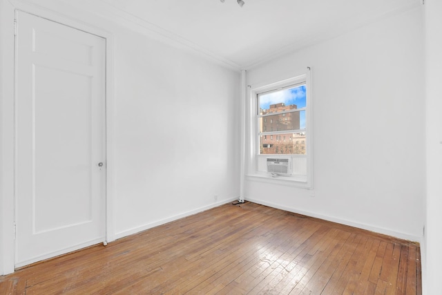 261 W 22nd St Unit 20, New York City, NY 10011 - empty room featuring light wood-style floors, baseboards, and crown molding
