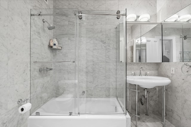 full bath with combined bath / shower with glass door and a sink