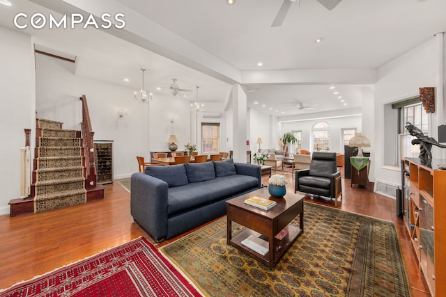 517 E 87th St Unit 1, New York City, NY 10128 - living room featuring a ceiling fan, wood finished floors, stairway, recessed lighting, and a chandelier