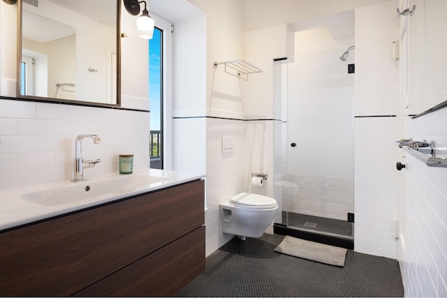 full bathroom with tile patterned floors, toilet, tile walls, a shower stall, and vanity