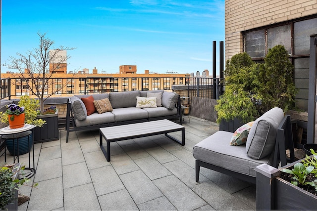 balcony featuring an outdoor hangout area and a patio area