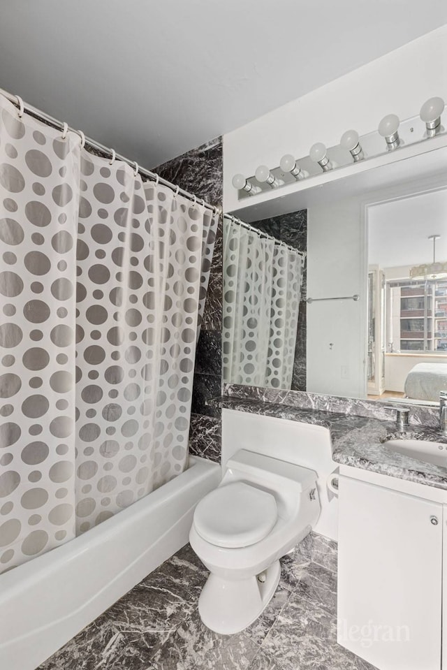 full bathroom featuring vanity, marble finish floor, toilet, and shower / tub combo with curtain