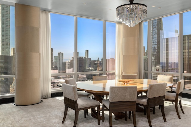 dining space featuring carpet floors, a view of city, a chandelier, and a wall of windows