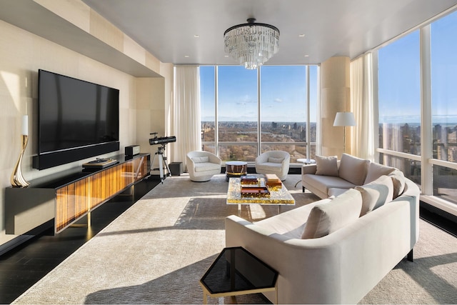 living room with expansive windows, wood finished floors, and a notable chandelier