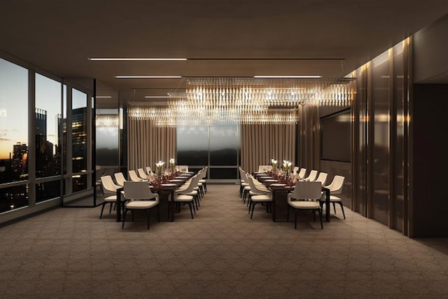 carpeted dining space featuring an inviting chandelier