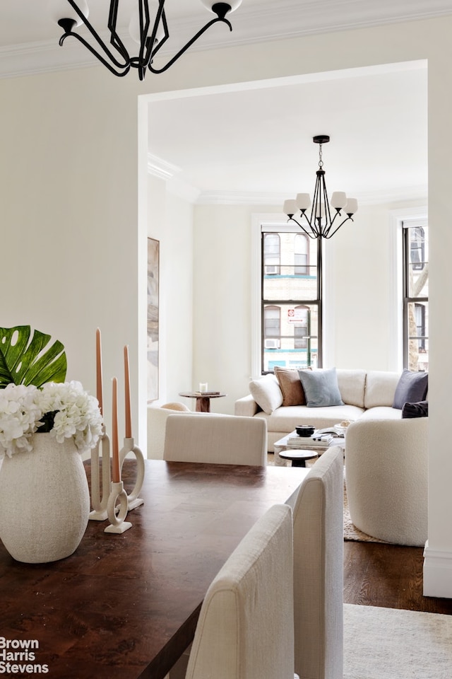302 Weirfield St, New York City, NY 11237 - dining space with a chandelier, ornamental molding, and wood finished floors