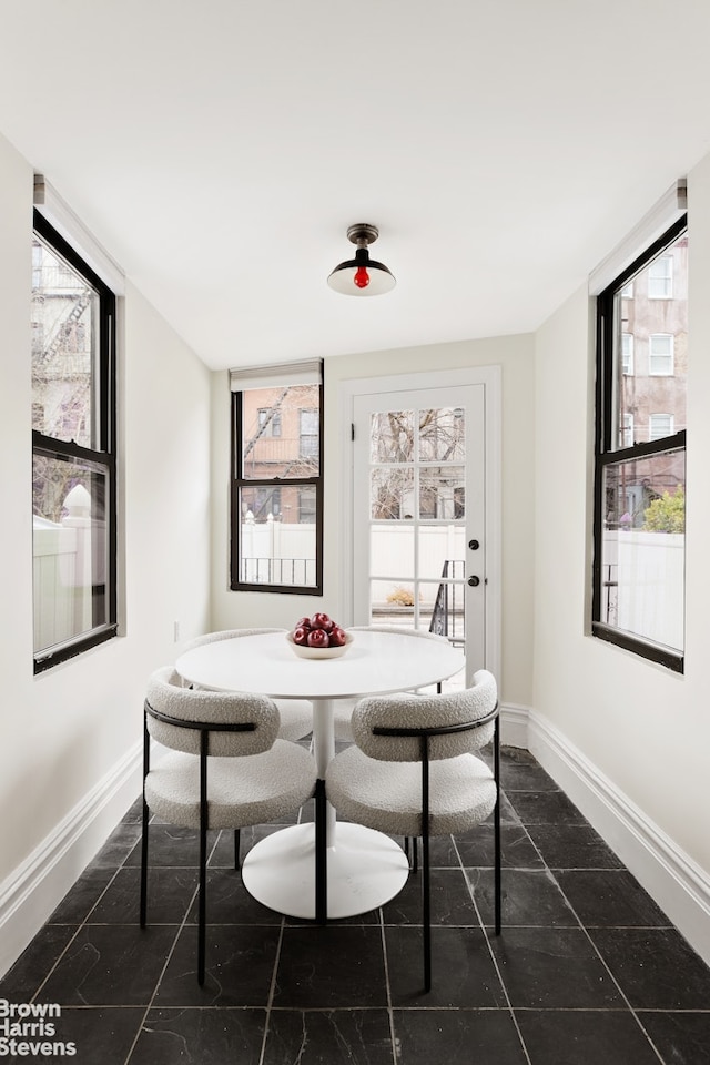 302 Weirfield St, New York City, NY 11237 - dining room with baseboards, healthy amount of natural light, and breakfast area
