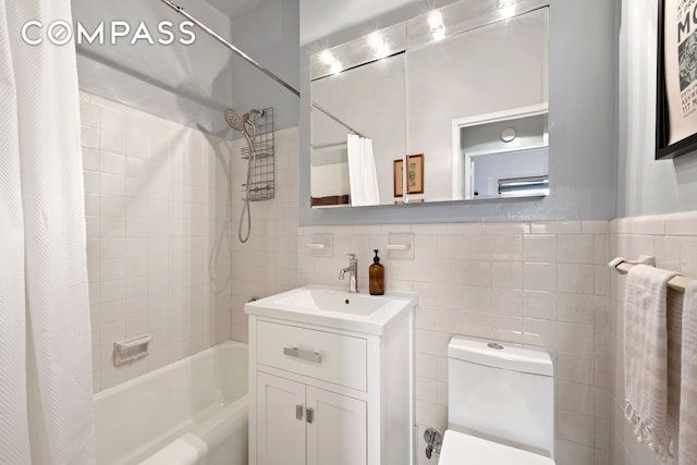 201 E 21st St Unit 12M, New York City, NY 10010 - bathroom with tile walls, shower / bath combo, vanity, and toilet
