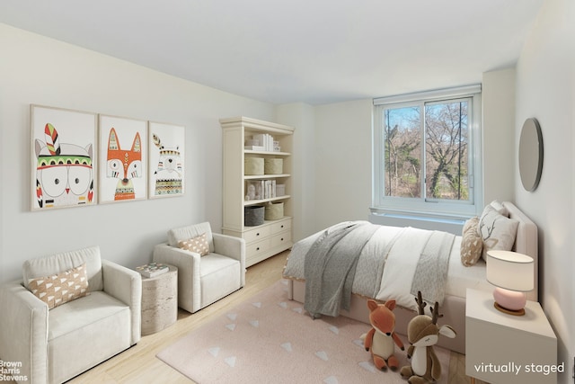 bedroom featuring wood finished floors