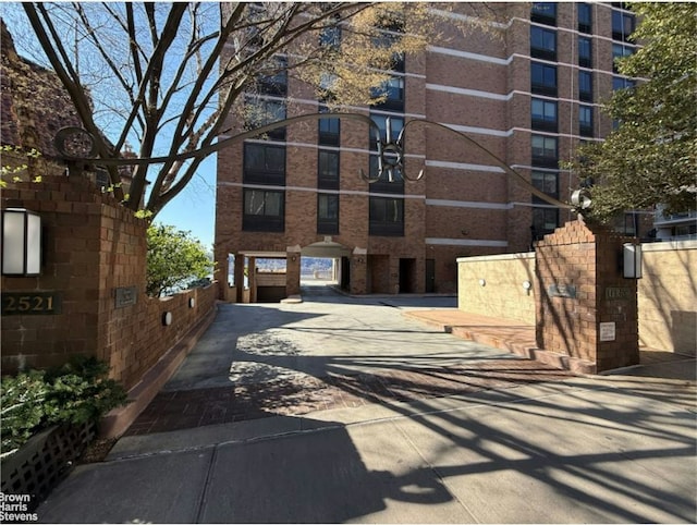 view of apartment building / complex featuring driveway
