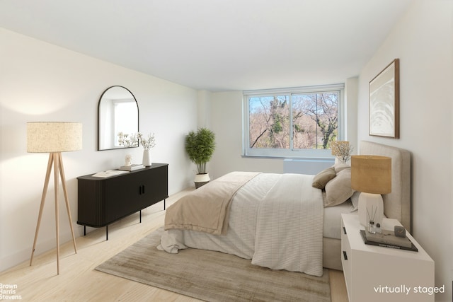 bedroom featuring light wood-type flooring