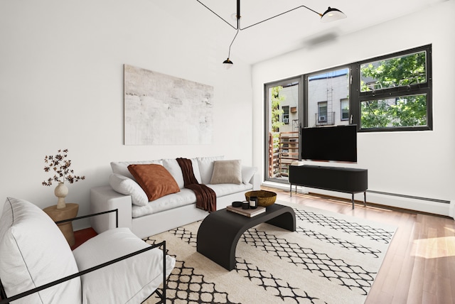 179 Jackson St Unit 5A, New York City, NY 11211 - living room with wood finished floors and baseboards
