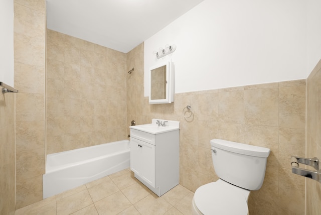 179 Jackson St Unit 5A, New York City, NY 11211 - full bath featuring vanity, toilet, tile patterned flooring,  shower combination, and tile walls