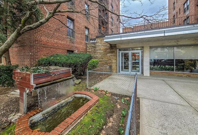 property entrance featuring french doors