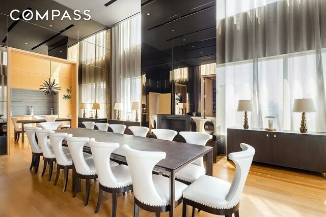 252 E 57th St Unit 60A, New York City, NY 10022 - dining space with wood finished floors and a high ceiling