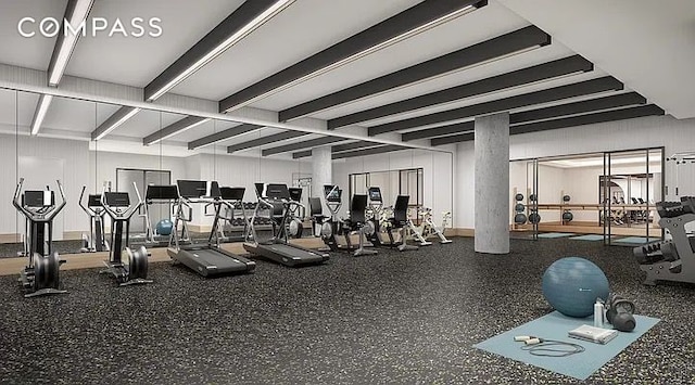 gym with beamed ceiling