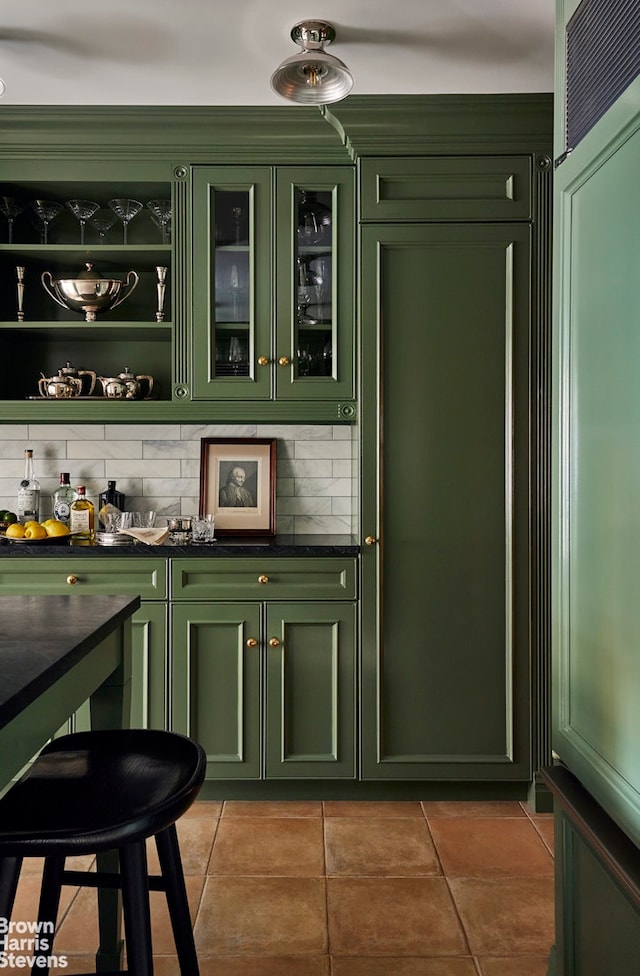 bar featuring tile patterned flooring and tasteful backsplash