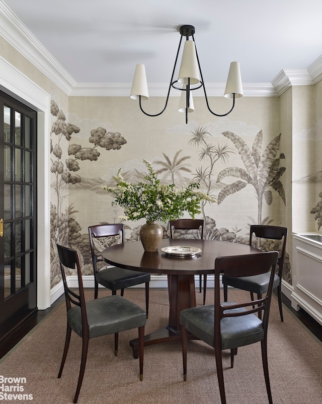 dining area featuring carpet flooring and ornamental molding