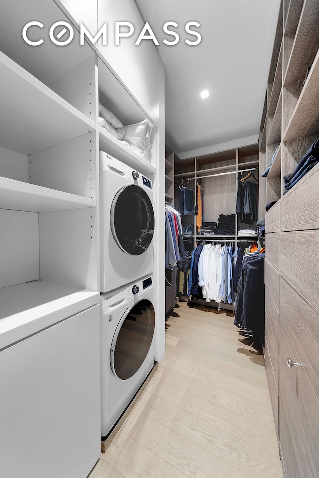 543 Broadway Unit 6, New York City, NY 10012 - laundry room featuring stacked washing machine and dryer