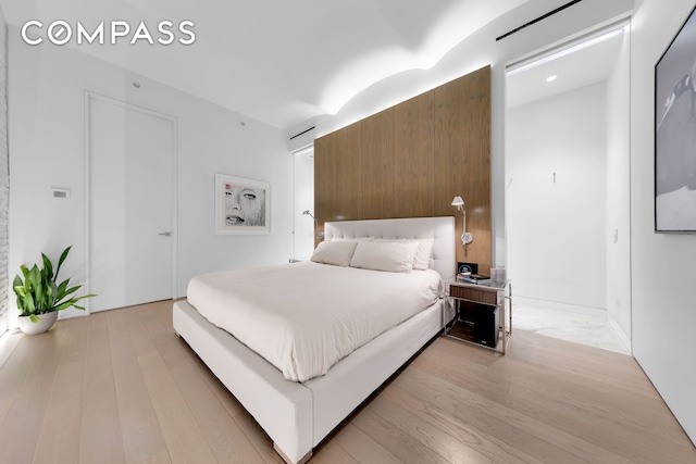 bedroom with light wood-type flooring