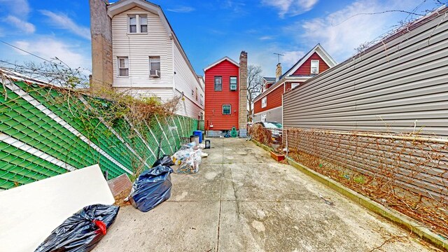 view of property exterior with a fenced backyard and a patio