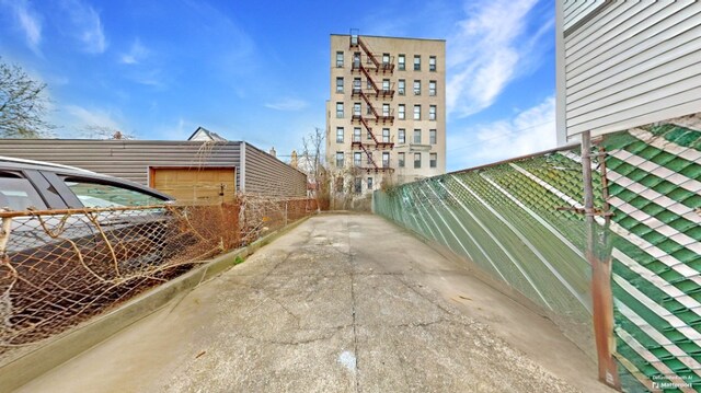 view of home's exterior featuring fence