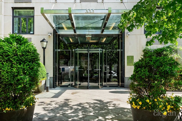 property entrance featuring a pergola