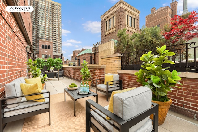 balcony with an outdoor hangout area and a patio