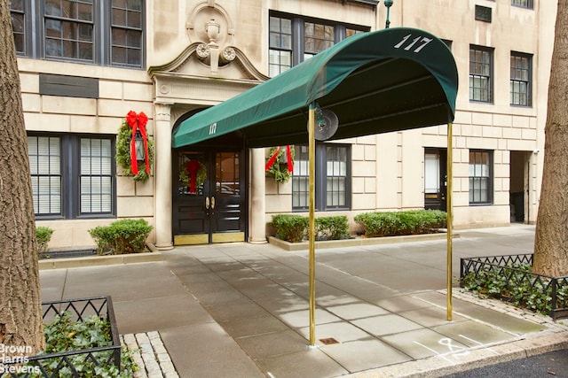 117 E 72nd St Unit 2W, New York City, NY 10021 - view of exterior entry featuring french doors