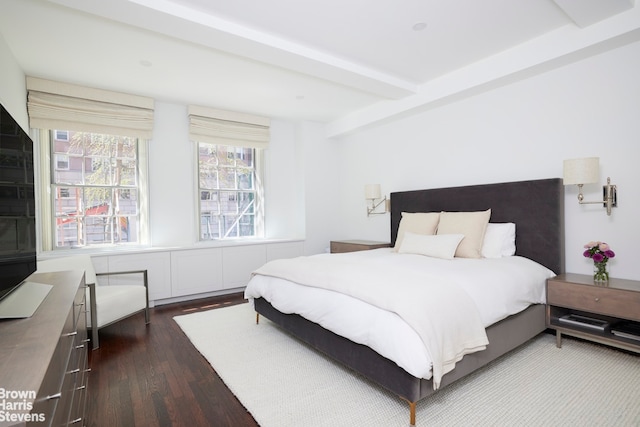 117 E 72nd St Unit 2W, New York City, NY 10021 - bedroom with dark wood-style flooring and beamed ceiling