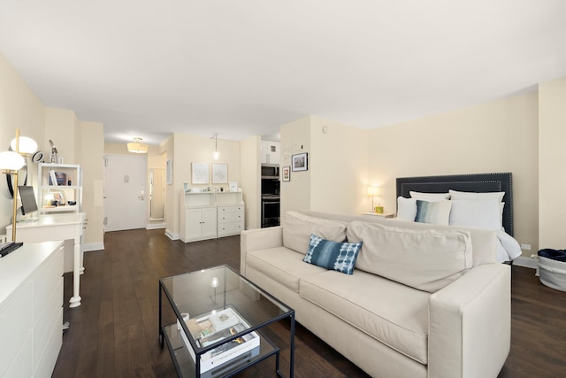 200 E 27th St Unit 2J, New York City, NY 10016 - living room with dark wood-style flooring and baseboards