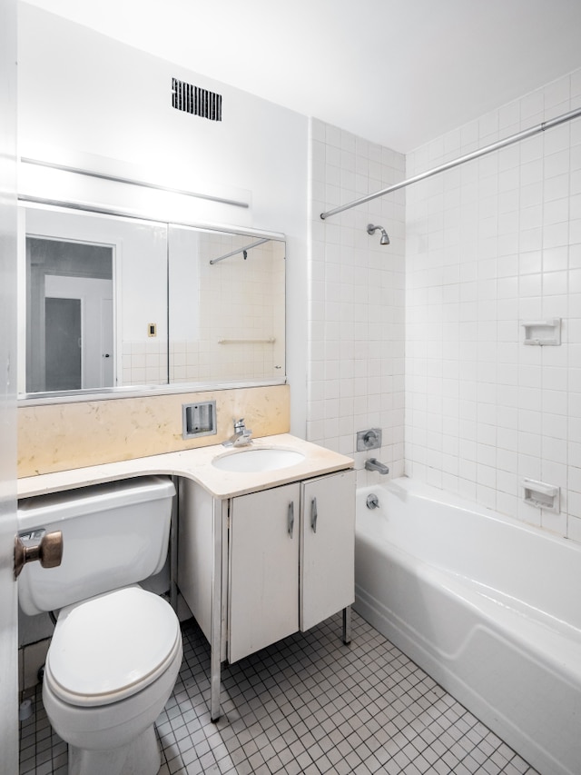 20 E 9th St Unit 2X, New York City, NY 10003 - bathroom with tile patterned flooring, vanity, and washtub / shower combination